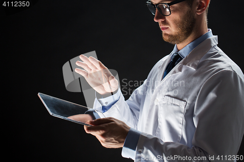 Image of close up of doctor or scientist with tablet pc