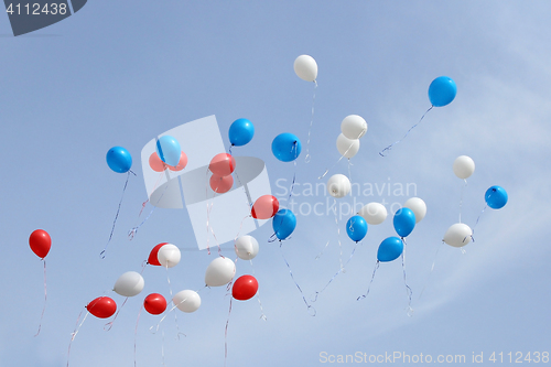 Image of colored balloons on sky