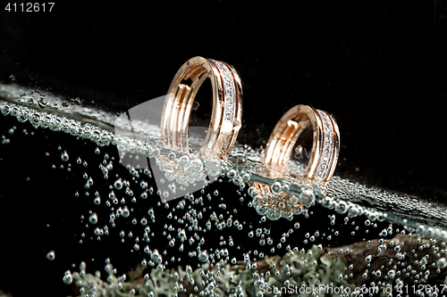 Image of Golden Rings In The Water