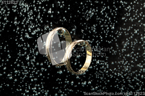 Image of Golden Rings In The Water