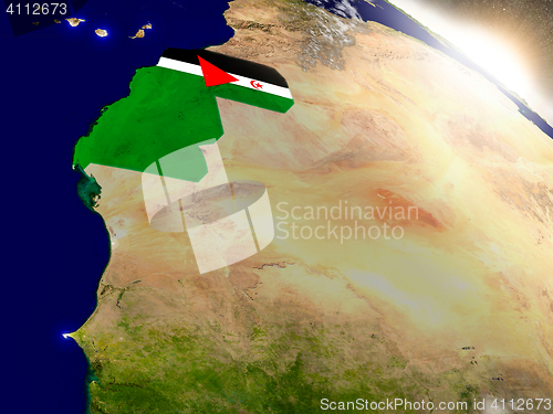 Image of Western Sahara with flag in rising sun