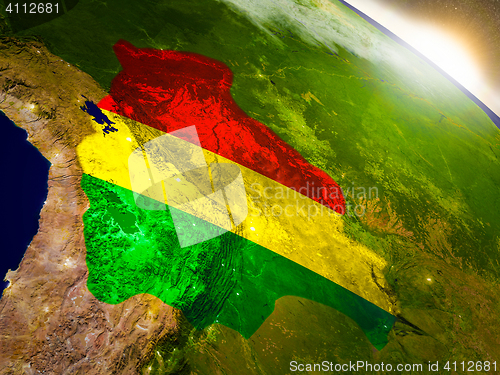 Image of Bolivia with flag in rising sun