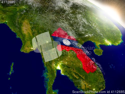 Image of Laos with flag in rising sun