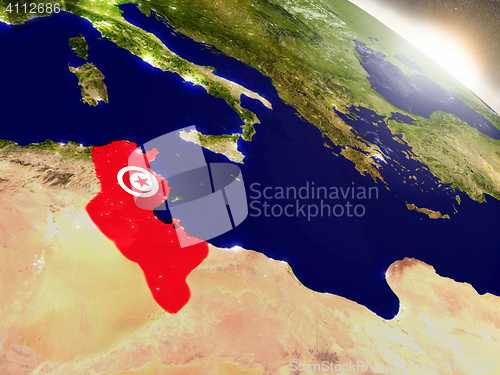 Image of Tunisia with flag in rising sun