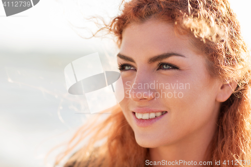 Image of close up of happy young redhead woman face