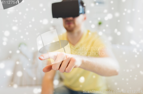 Image of young man in virtual reality headset or 3d glasses