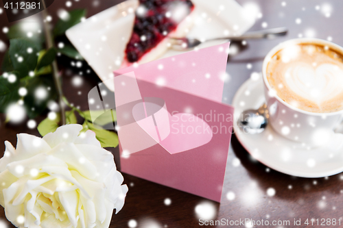 Image of close up of greeting card with heart and coffee