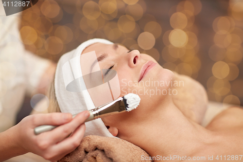 Image of close up of young woman and cosmetologist in spa