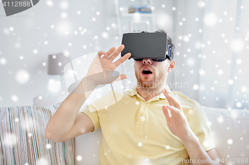 Image of young man in virtual reality headset or 3d glasses