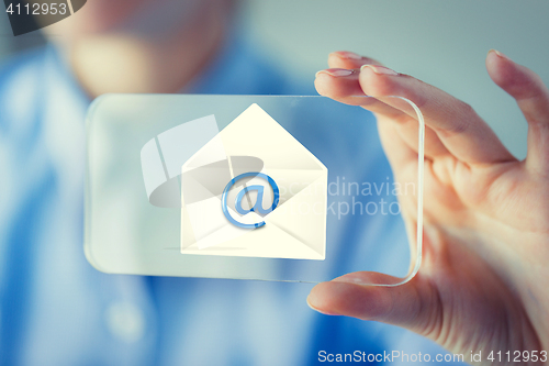 Image of close up of woman with transparent smartphone