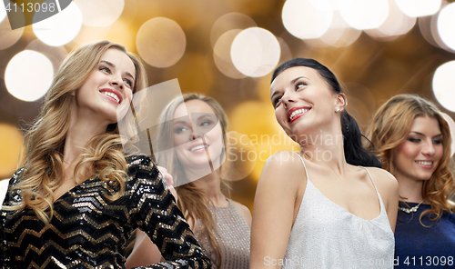 Image of happy young women dancing at night club disco