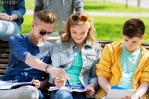 Image of group of students with notebooks at school yard