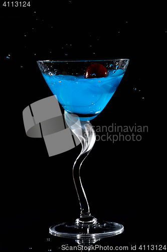 Image of Cherry dropping into cocktail