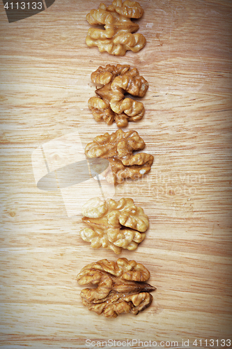 Image of Row of walnuts above view
