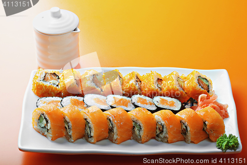Image of Salmon rolls and saucer