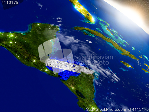 Image of Honduras with flag in rising sun