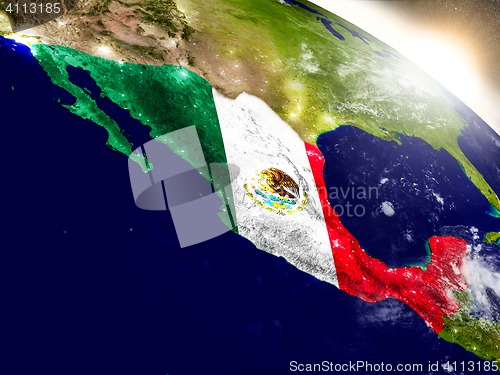 Image of Mexico with flag in rising sun