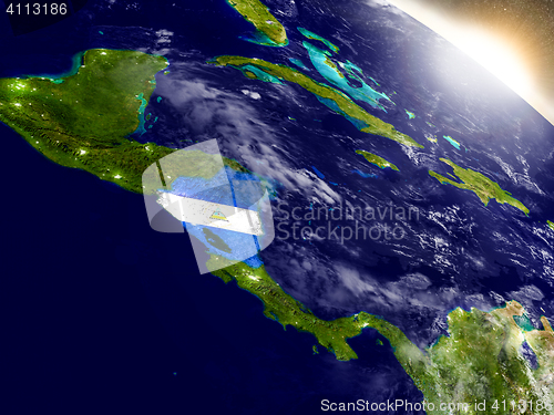 Image of Nicaragua with flag in rising sun