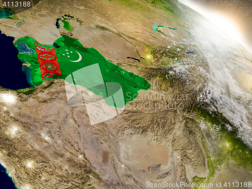 Image of Turkmenistan with flag in rising sun