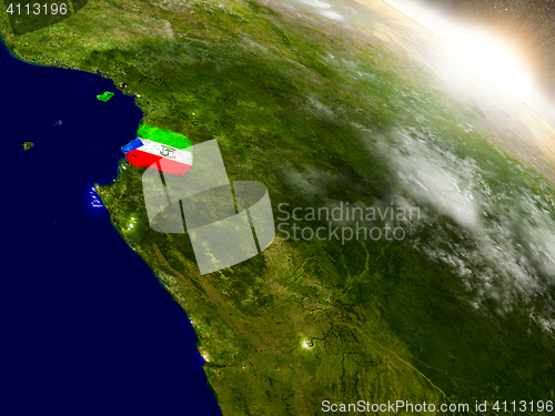 Image of Equatorial Guinea with flag in rising sun