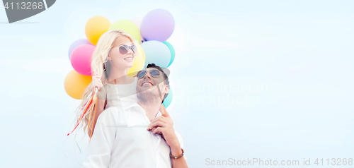 Image of couple with colorful balloons