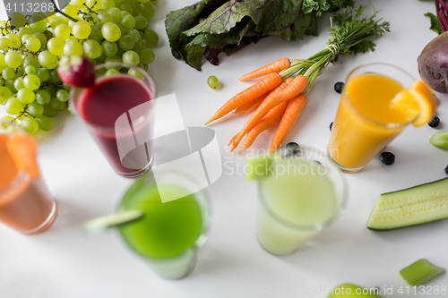 Image of glasses with different fruit or vegetable juices