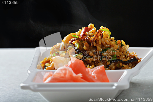 Image of Steam over Vietnamese pilaf with vegetables