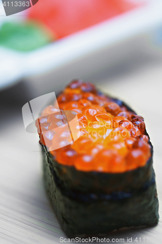 Image of Ikura sushi with ginger and wasabi