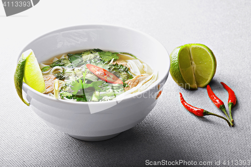 Image of Pho bo soup with lime and chili