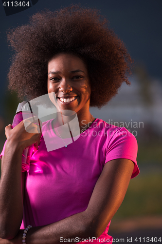 Image of Portrait of a young african american woman running outdoors