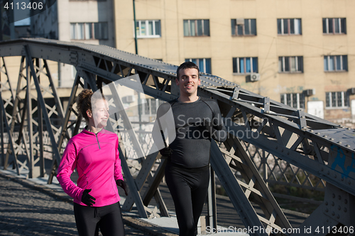 Image of young  couple jogging