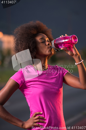 Image of Portrait of a young african american woman running outdoors