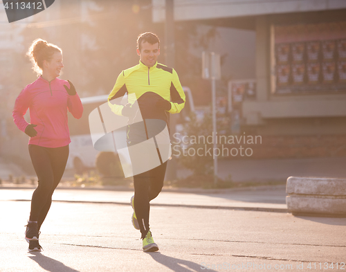 Image of young  couple jogging