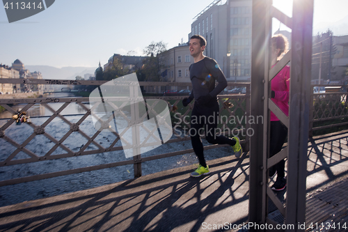 Image of young  couple jogging
