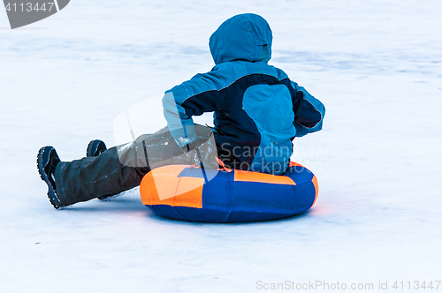 Image of Baby winter sledding on the Ural River.