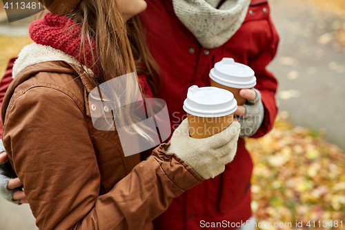 Image of close up of happy couple with coffee in autumn