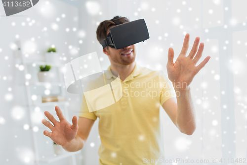 Image of young man in virtual reality headset or 3d glasses