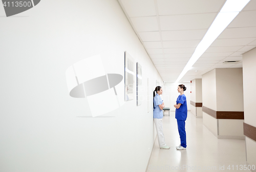 Image of female doctors or nurses talking at hospital