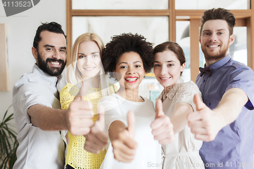 Image of happy creative team in office