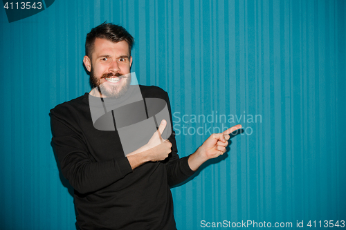 Image of Portrait of young man with shocked facial expression