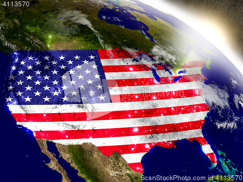 Image of USA with flag in rising sun