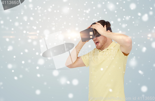 Image of happy man in virtual reality headset or 3d glasses