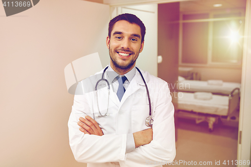 Image of smiling doctor with stethoscope at hospital 