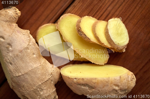 Image of close up of ginger root on wooden table