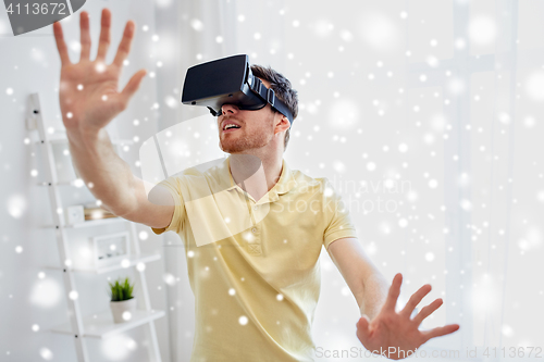 Image of young man in virtual reality headset or 3d glasses