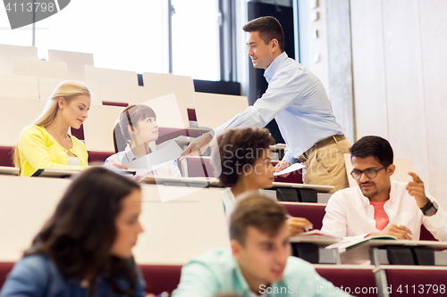 Image of teacher giving test to students on lecture