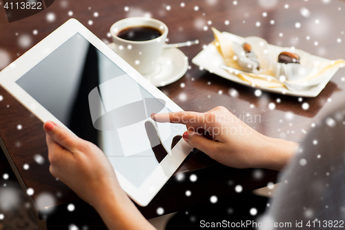Image of close up of woman with tablet pc and coffee