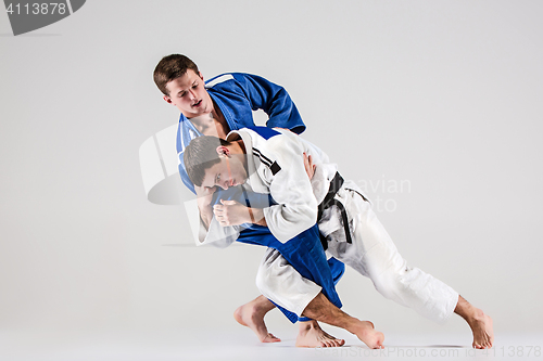 Image of The two judokas fighters fighting men