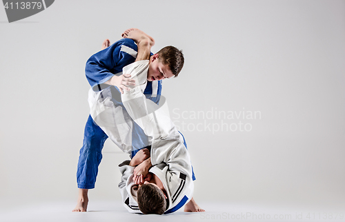 Image of The two judokas fighters fighting men