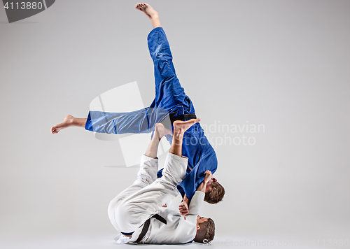 Image of The two judokas fighters fighting men